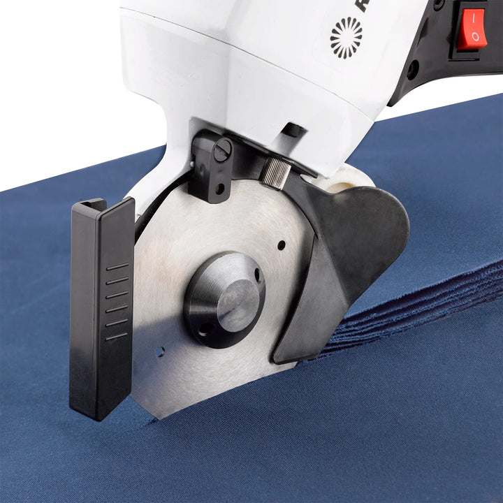 Close-up of an Octaknife saw cutting blue material, several layers thick.