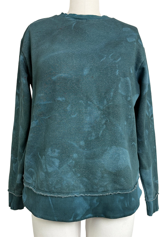 Dyed example: Back view of a teal tie-dye sweatshirt on a mannequin against a white background