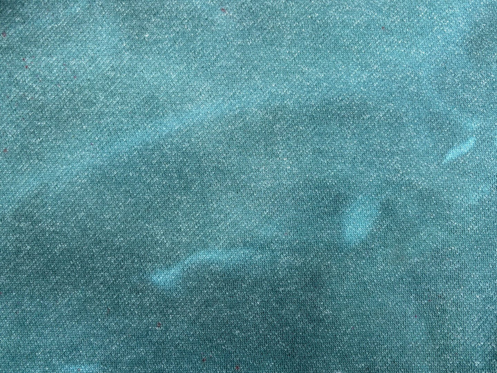 Dyed example: Textured teal fabric up-close