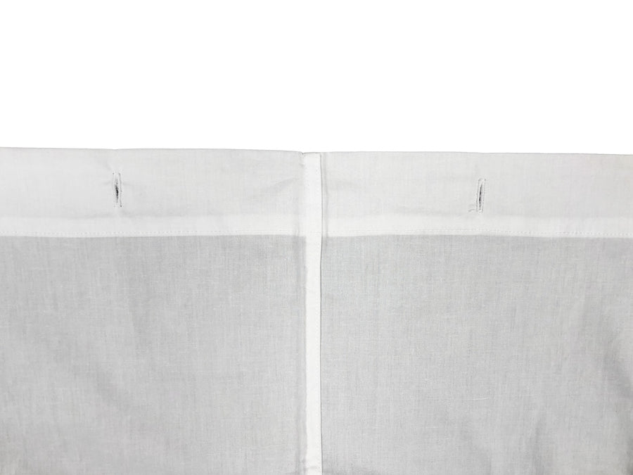 Close up of narrow center hem that runs vertically down center of cotton shower curtain.