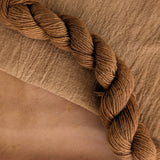 Cutch Extract - Acacia catechu Dyed examples were done at 50% OWG. We used our Silk Hankies (#SH), our Cotton Bubble Gauze (#CG2-50"), and our Single Sock HT Mini Skeins (#YARN104)