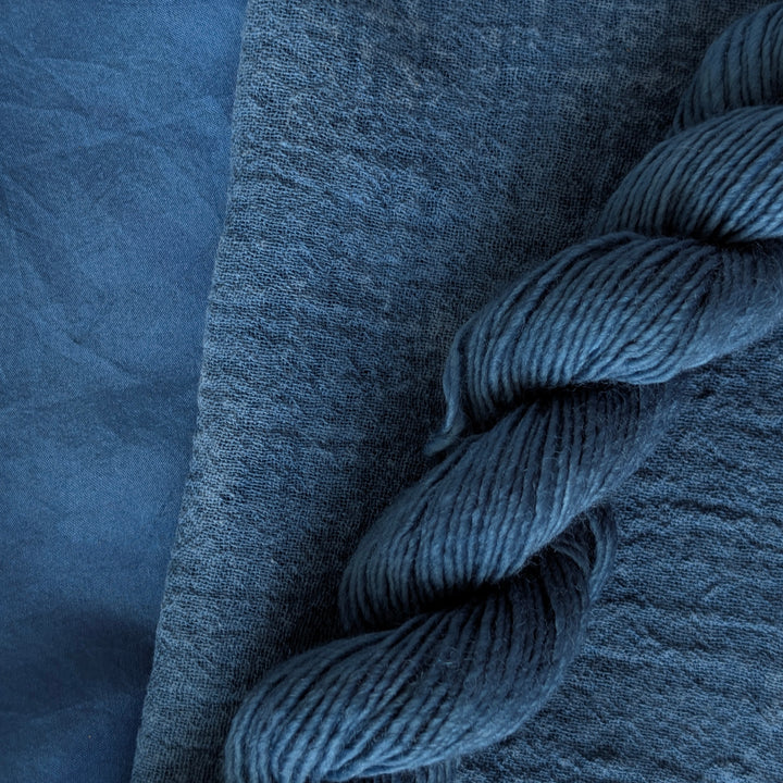 Indigo Extract - Indigofera tinctoria Dyed examples were done at 50% OWG. We used our Silk Hankies (#SH), our Cotton Bubble Gauze (#CG2-50"), and our Single Sock HT Mini Skeins (#YARN104)