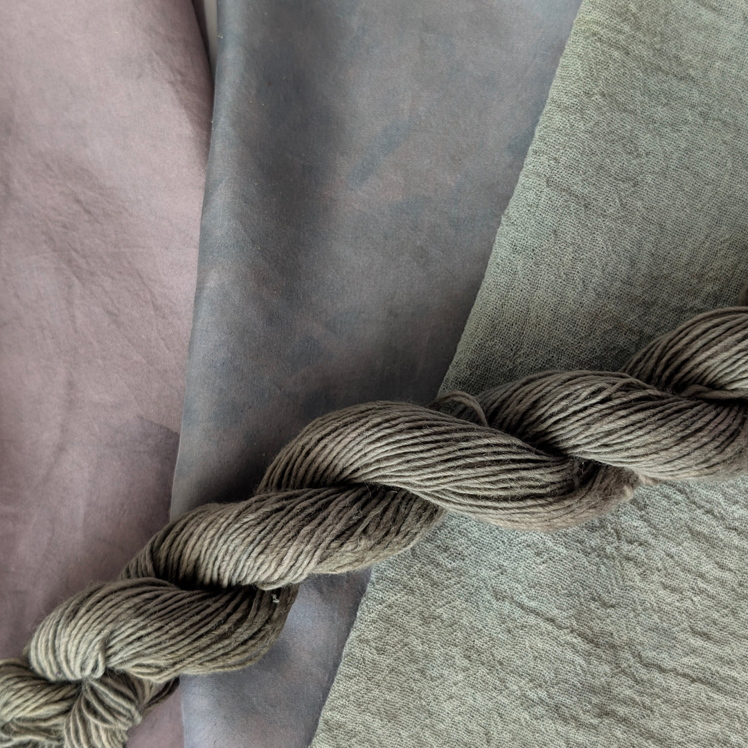Indigo Leaves - Indigofera tinctoria Dyed examples were done at 50% OWG. We used our Silk Hankies (#SH), our Cotton Bubble Gauze (#CG2-50"), and our Single Sock HT Mini Skeins (#YARN104)