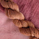 Lac - Laccifer laca/Kerria laca Dyed examples were done at 50% OWG. We used our Silk Hankies (#SH), our Cotton Bubble Gauze (#CG2-50"), and our Single Sock HT Mini Skeins (#YARN104)