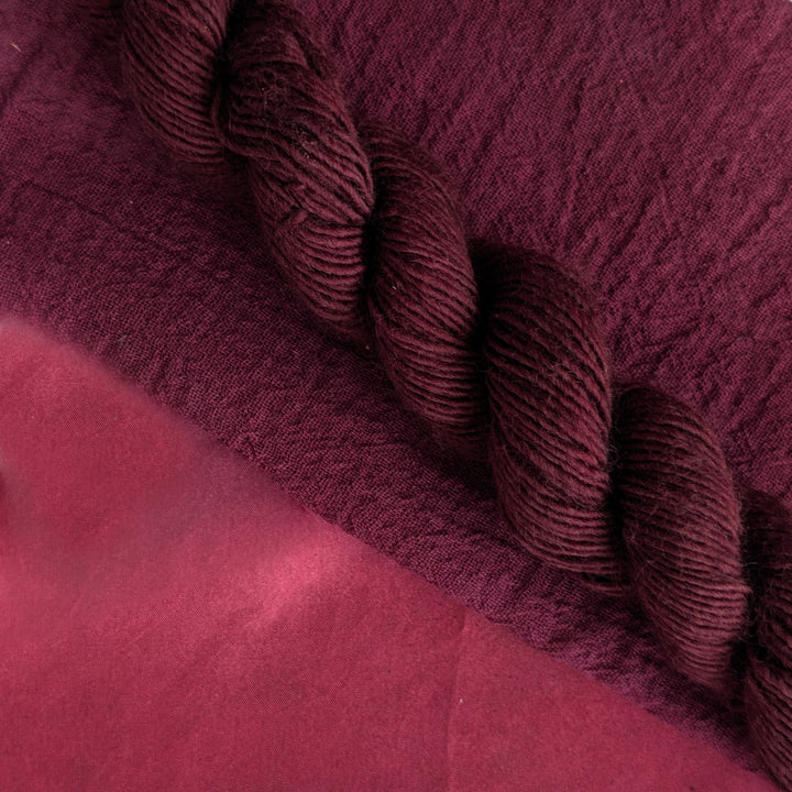 Lac  Extract - Laccifer laca/Kerria laca Dyed examples were done at 50% OWG. We used our Silk Hankies (#SH), our Cotton Bubble Gauze (#CG2-50"), and our Single Sock HT Mini Skeins (#YARN104)