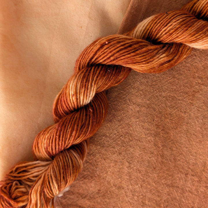 Red Sandalwood - Pterocarpus santalinus Dyed examples were done at 50% OWG. We used our Silk Hankies (#SH), our Cotton Bubble Gauze (#CG2-50"), and our Single Sock HT Mini Skeins (#YARN104)