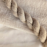 Walnut Hulls - Juglans Regia Dyed examples were done at 50% OWG. We used our Silk Hankies (#SH), our Cotton Bubble Gauze (#CG2-50"), and our Single Sock HT Mini Skeins (#YARN104)