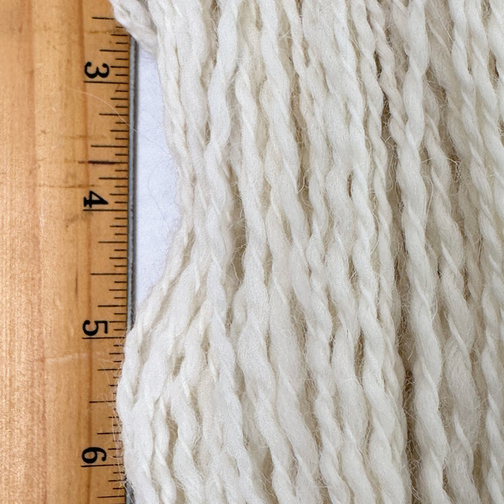 Close up of Peruvian Tweed strands shown with ruler for scale
