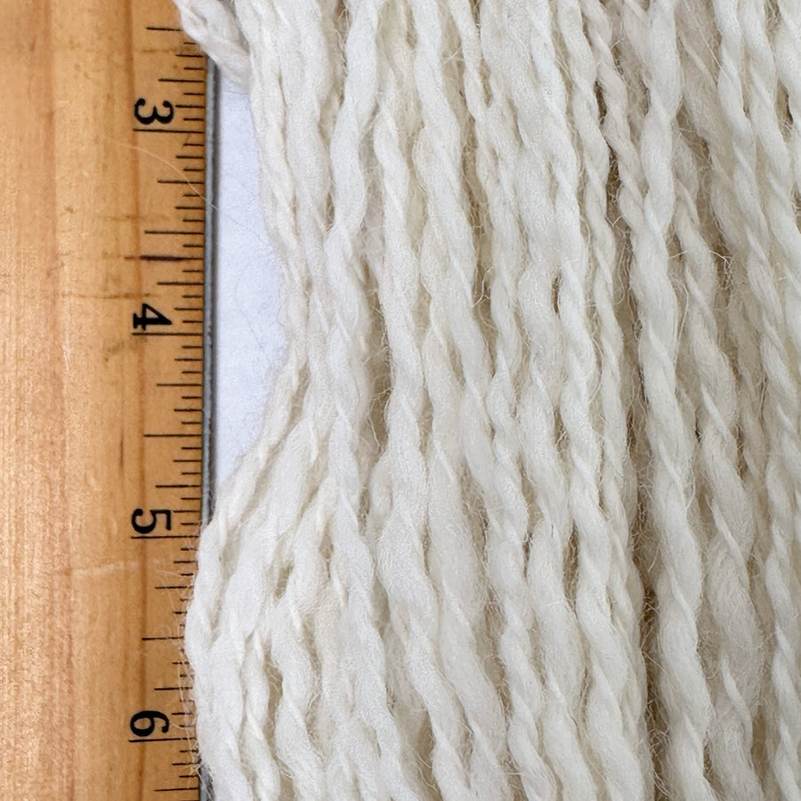 Close up of Peruvian Tweed strands shown with ruler for scale