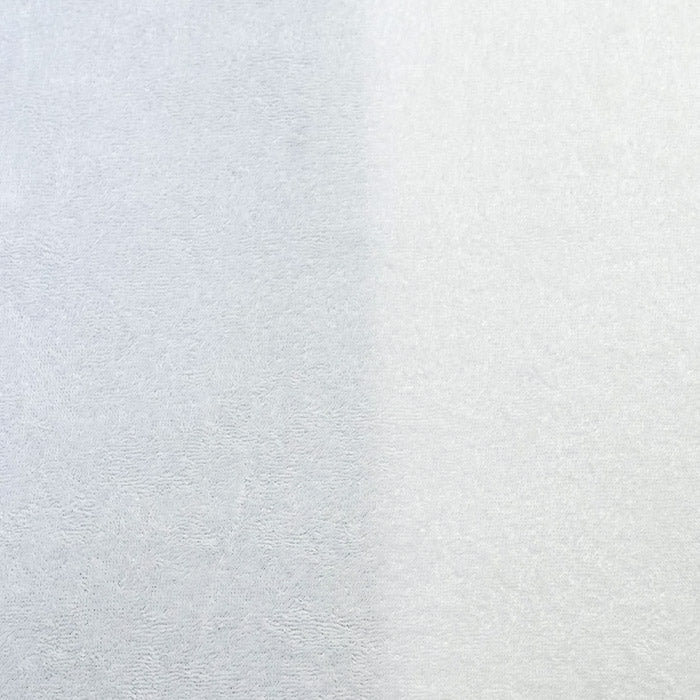 Close-up of flaid-flat white fabric with a soft, low pile terry cloth loop texture.