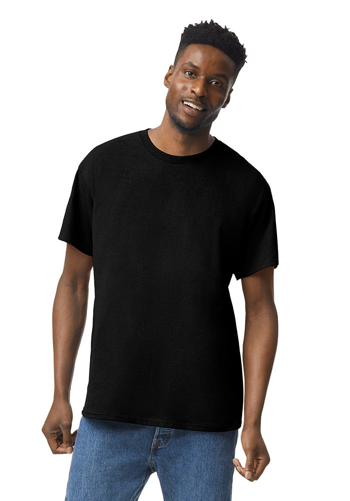 Man wearing a black Gildan 5.3oz. Cotton Short Sleeve T-shirt and blue jeans on a white background.