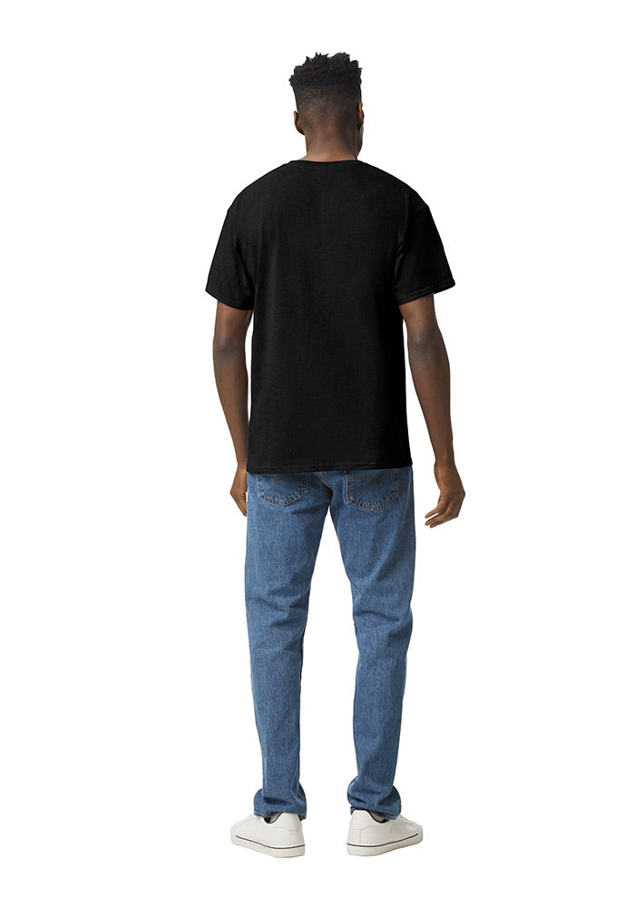 Back view of a man wearing a black Gildan 5.3oz. Cotton Short Sleeve T-shirt and blue jeans on a white background.