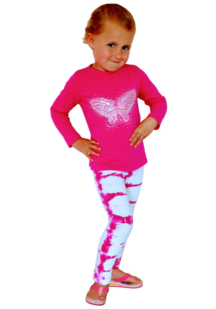 A child wearing a pink top and pink and white cotton/spandex ankle-length leggings on a white background.