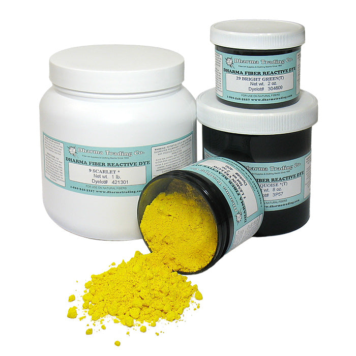 Dharma Trading Fiber Reactive Dye in black jars with blue labels, yellow dye pigment tumbling out on a white background.